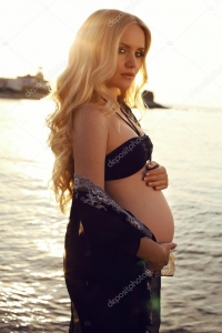 depositphotos_76753683-stock-photo-beautiful-pregnant-woman-with-long.jpg
